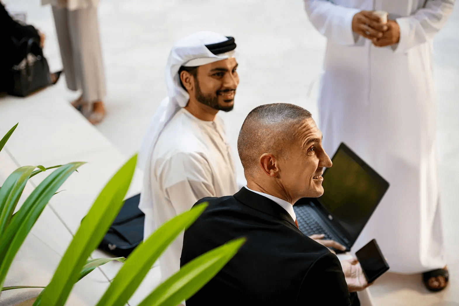 An Emirati businessman and an international executive in a meeting in Dubai
